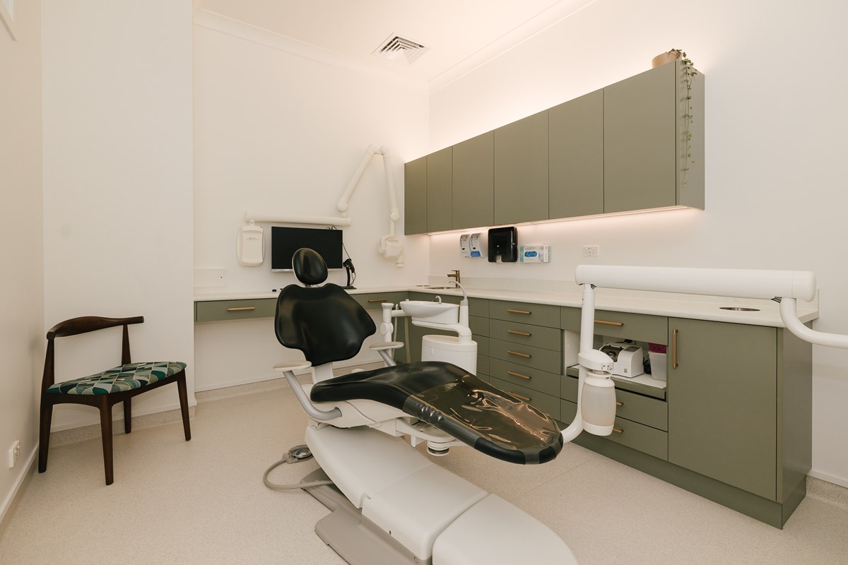 dental surgery room featuring moss green joinery 